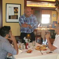 <p>Sal Latorraca, who owns Water&#x27;s Edge at Giovanni&#x27;s with his wife, JoAnn, talks with diners at the event. </p>