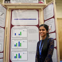 <p>Meena Mundackal is shown with her project.</p>