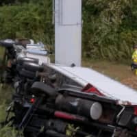 <p>Two tractor-trailer trucks went down an embankment on I-95 on Friday morning, shutting down the right and center lanes between Exits 42 and 41 in West Haven.</p>