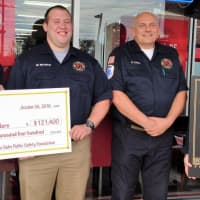 <p>Firehouse Subs presents the West Milford Fire Department with money for extrication equipment at a ceremony in Totowa.</p>