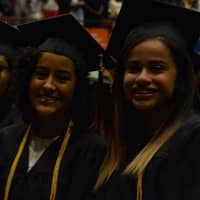 <p>Happy and excited graduates of White Plains High School take part in commencement exercises at the County Center Saturday.</p>