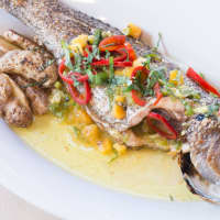 <p>Whole roasted black sea bass at Saltaire</p>