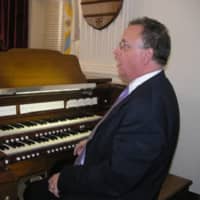 <p>Craig S. Williams demonstrates the Console of the Wicks organ at the Old Cadet Chapel at West Point. He and trumpeter Bill Owens will be performing in Tuckahoe.</p>
