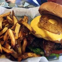 <p>Rony&#x27;s Rockin&#x27; Grill&#x27;s Stevie is a cheeseburger is adorned with grilled pineapple, bacon, lettuce and tomato.</p>