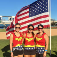 <p>Left to right, teachers Allyson DeRoin, Lisa Pesce and Erica Ghirardi dressed as Wonder Woman as they climbed. Pesce, whose husband is a veteran, was an award winner, climbing a total of 9,000 steps.</p>