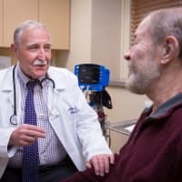 <p>William Goumas, MD, Medical Director, Wound and Hyperbaric Institute and patient discuss Hyperbaric treatment options.</p>