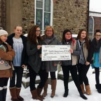 <p>Members of Wyckoff Troop 24 present their $700 check to help with the headstones restoration.</p>
