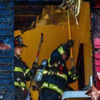 <p>Poughkeepsie firefighters work to control a fire on Hooker Avenue.</p>