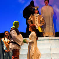 <p>Rye High School students rehearse for &quot;Shrek the Musical.&quot; The cast includes Cameron Kamer as Shrek and Penny Deen as Fiona. There are three shows: at 7:30 p.m. Friday and Saturday, as well as a 2 p.m. matinee.</p>