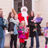 <p>Santa poses with Maureen LaPenta, third from right, her five children and two unidentified women.</p>