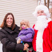 <p>Maureen LaPenta poses with one of her daughters and Santa at her home in Blauvelt. Her husband, Joe, is stationed overseas in Kuwait and won&#x27;t be home for the holidays.</p>
