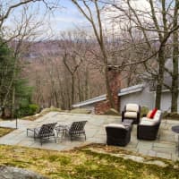 <p>Luxury is included in the backyard with a patio overlooking the wooded backdrop.</p>