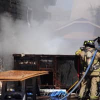 <p>The blaze apparently began in a roll-off garbage container.</p>