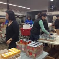<p>Volunteers at Hillside Food Outreach helped pack over 1000 bags of food for homebound families in Westchester.</p>