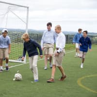 <p>Boys play soccer while enjoying time out of the classroom during the opening week at Ridgefield Academy.</p>