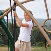 <p>Emma Hayes-Setterlund of Wilton enjoys the outdoors at Ridgefield Academy, which returned to class last week.</p>