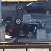<p>A car on its roof at a toll booth on the Garden State Parkway in Barnegat, NJ.</p>