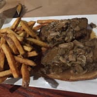 <p>An open-faced meatloaf sandwich with a side of regular fries at the Barnum Publik House in Bridgeport.</p>