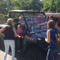 <p>Bedford moms keep an eye on the little ones as they explore a police vehicle Saturday during the town&#x27;s annual Truck Day.</p>