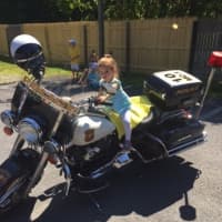 <p>A mini-motorcyclist rides tall in the saddle at Bedford&#x27;s recent Truck Day.</p>