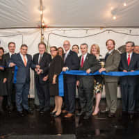 <p>President Michael J. Smith (center) cuts the ribbon with inaugural MBA students, administrators, faculty and civic leaders, including Woodland Park Mayor Keith Kazmark and state Assembly members Holly Schepisi, Shavonda Sumter and Scott Rumana.</p>