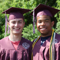 <p>Bethel High School seniors Kevin Sholtes, left, and David Hayes show their excitement for the march at their former elementary schools.</p>