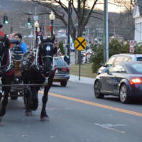 <p>Residents enjoy horse-drawn carriage rides before the Bethel tree lighting.</p>