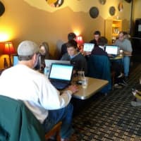 <p>Customers enjoy a little tech with their coffee at The Black Cow in Croton-on-Hudson.</p>