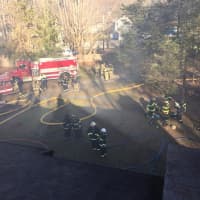 <p>Firefighters respond to a fire on Fir Tree Lane in Newtown on Sunday</p>