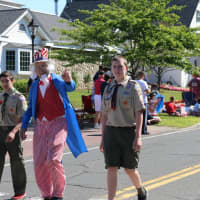 <p>&quot;Uncle Sam&quot; marches with Boy Scouts in the New Fairfield 4th of July parade.</p>