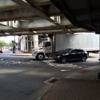 <p>The box truck is jammed under the bridge in busy SoNo on Friday afternoon. </p>