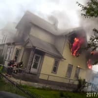 <p>Firefighters encountered heavy fire when they arrived at the home on Maple Street.</p>