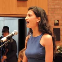 <p>A singer performs at the Bronxville High School June 12 annual baccalaureate.</p>