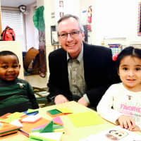 <p>Family Centers’ CEO Bob Arnold is shown with a child from The Grauer Preschool.</p>