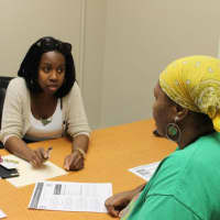 <p>Family Centers Resident Services Coordinator Shawnece Simmons works with a resident of Charter Oak Communities on goal planning.</p>