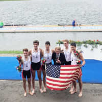 <p>Westport&#x27;s Harrison Burke, second from left, celebrates with other crew members after winning a bronze medal at the World Junior Championships.</p>