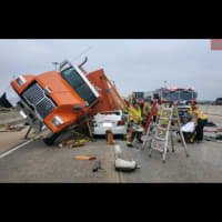 <p>A dump truck full of stones partially rolled into a sedan along Route 30, Fruitville Pike in Lancaster, Pennsylvania.</p>