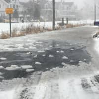 <p>Water begins to cover Canal Road in Westport on Thursday</p>