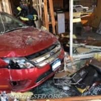 <p>A car slammed into the Cambareri Building on Bedford Road causing major damage.</p>