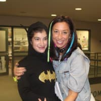 <p>Carolynn Kaufman spends time with Ellie Routhier at a Halloween party last year at the New Canaan YMCA. Kaufman is the Director of Special Needs at the Y.</p>