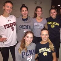 <p>Girls from Connecticut Boat Club wear shirts with their college choices.</p>