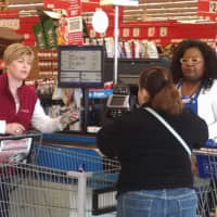 <p>Kim Morgan, left, of the United Way of Western Connecticut surprises shoppes at PriceRite in Danbury.</p>