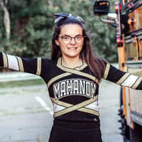 <p>Brandi Levy in her Mohanoy High School cheerleading uniform after she allowed on the team in 2017, following the Snapchat post.</p>