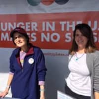 <p>Hillary Gibson and Kate Albrecht, volunteers with Community Plates, explain the nonprofit&#x27;s mission. The Chowdafest in Westport benefits the hunger nonprofit. </p>