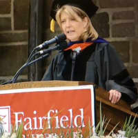 <p>Cindi Bigelow, CEO of Bigelow Teas, speaks at the commencement exercises for graduate students Sunday at Fairfield University.</p>