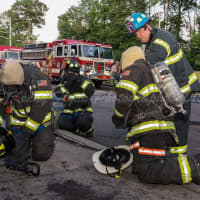 <p>New City firefighters undergo a training exercise.</p>