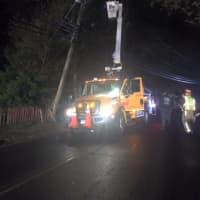 <p>United Illuminating crews go to work to repair the pole.</p>