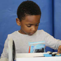 <p>A student tests his boat as part of Greenburgh Schools&#x27; Engineers Week.</p>