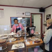 <p>Angela cheerfully serves a customer on a gray and raining day. She makes you feel like she&#x27;s glad you&#x27;re there.</p>