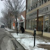 <p>It&#x27;s a slushy mess near the Goodwill Store on Main Street in Danbury, but help is on the way as a man with a shovel moves through.</p>